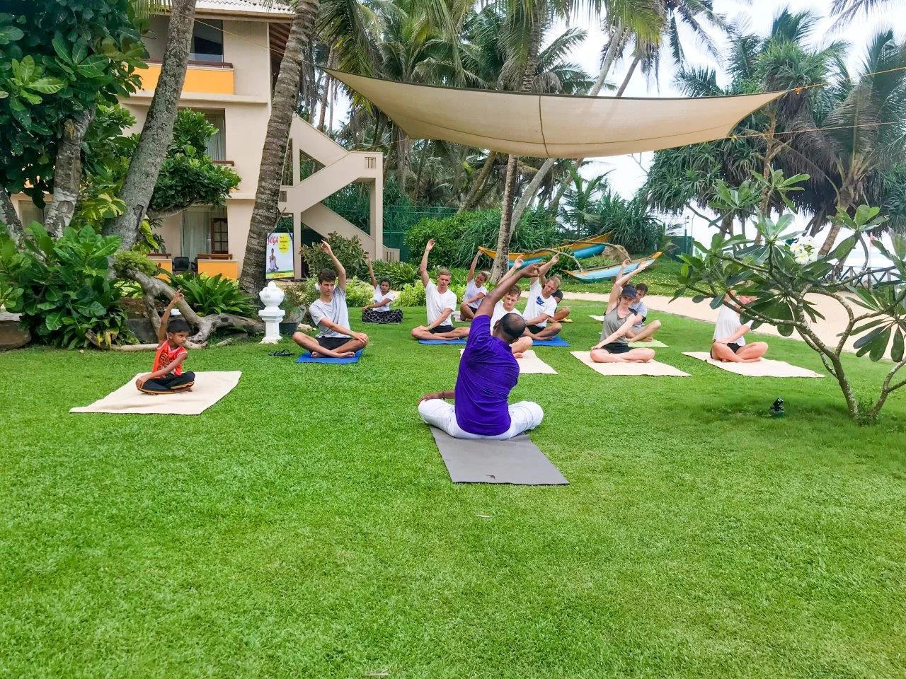 yogis practicing poses in insight resort ahangama